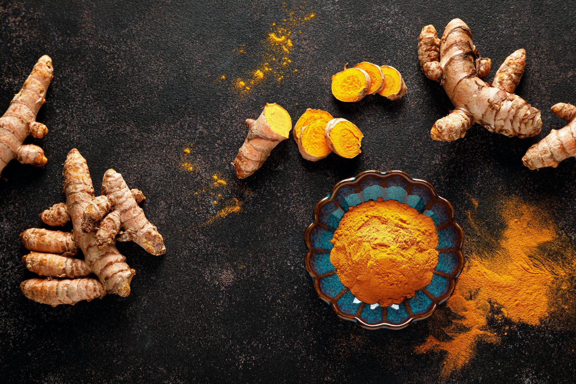 Turmeric. Fresh turmeric root and turmeric, curcumin powder